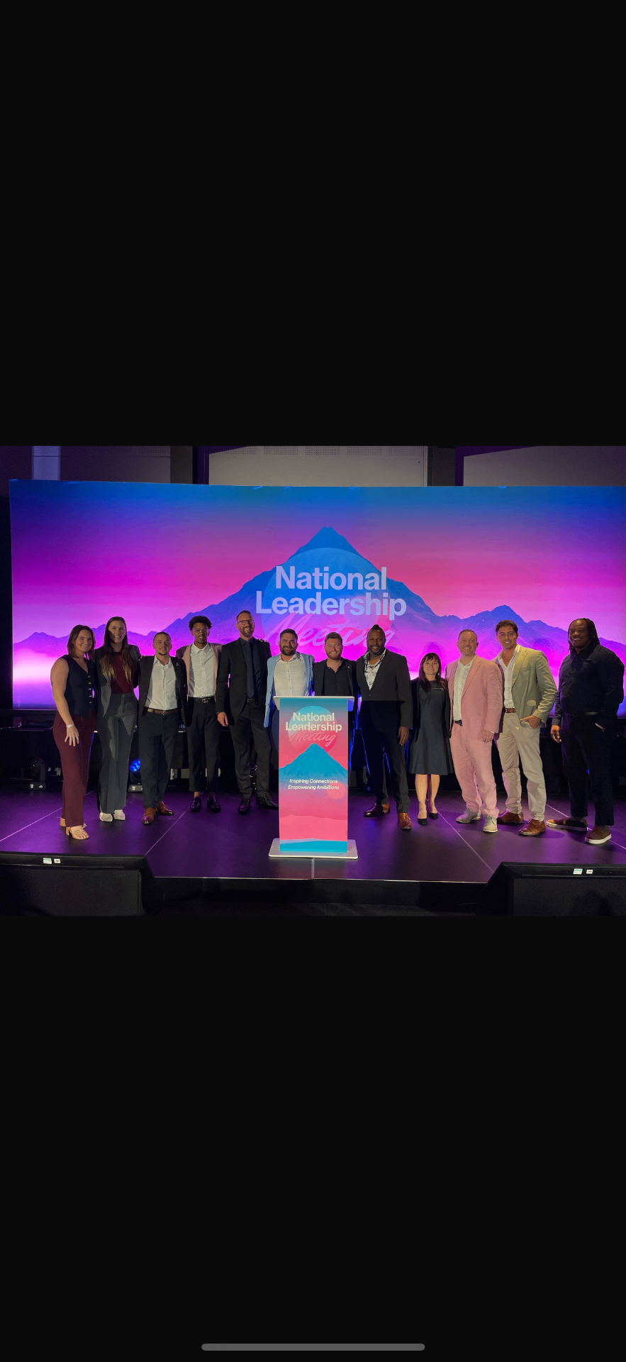 National Leadership Meeting — team on stage